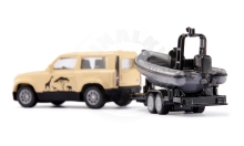 SIKU Blister - Land Rover Defender Safari s člunem