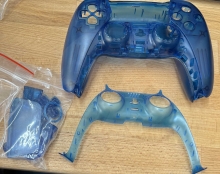 Náhradní skořepina pro ovladač PS5 DualSense V1 (ZCT1W) - průhledná modrá (PS5)